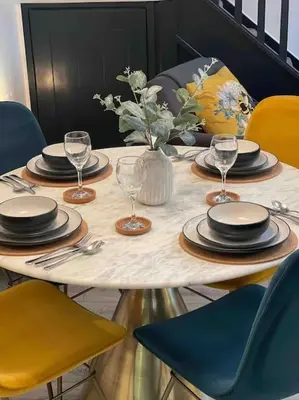 a table with plates and wine glasses on it at Watchhall, Annan, Dumfries & Galloway, Scotland Barn - 2 Bed in Annan