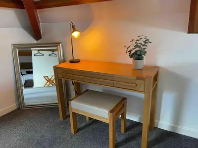 a desk with a potted plant and a mirror at Watchhall, Annan, Dumfries & Galloway, Scotland Barn - 2 Bed in Annan