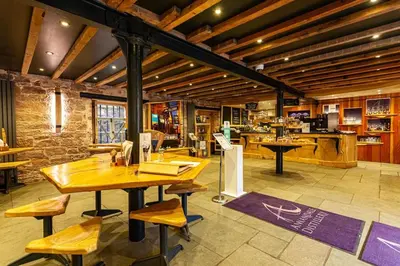 a room with a table and chairs and a kitchen at Watchhall, Annan, Dumfries & Galloway, Scotland Barn - 2 Bed in Annan