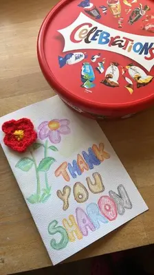 a happy new year card with a flower on a table at Station House Flat on outskirts of Thornhill in Thornhill
