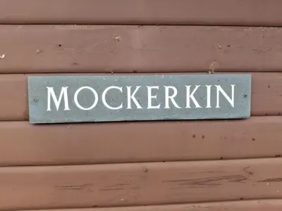 a sign that says mokeeperkin on a wall at Lodge by the Lake - Lake District - Hot Tub in Bassenthwaite