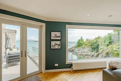 a room with a view of the ocean at Balcary Tower in Castle Douglas
