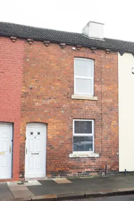 a brick building with white doors and windows at CS House in Carlisle