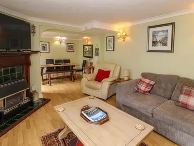a living room with a couch and a table at Brews Cottage in Keswick