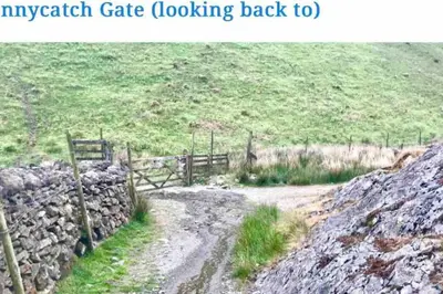 a dirt road with a fence and a rock wall at CosyHouse2 Private Parking Base for Lake District and Sellafield in Cleator Moor