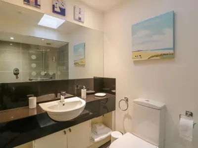 a bathroom with a sink and a toilet at The Stables at Daldorch in Mauchline