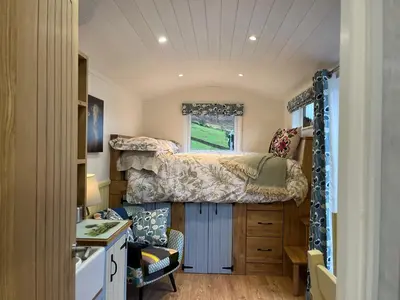 a small bedroom with a bed and a window at The Shepherd's Nook in Thirlmere