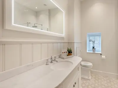 a white bathroom with a sink and a toilet at 2 Bed in Cockermouth 95716 in Broughton Moor