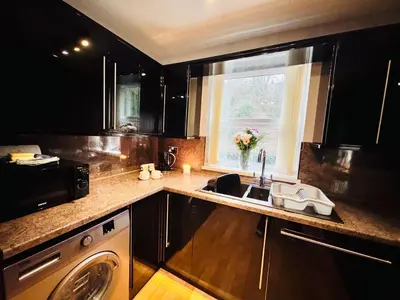 a kitchen with a sink and a window at New Road Apartment - 2 Bedrooms - Sleeps 3 in Whitehaven