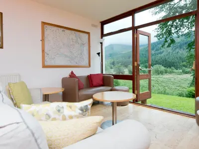 a living room with a couch and a table at YHA Ennerdale in Buttermere
