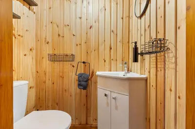 a bathroom with a toilet and a sink at Newsham Lodge in Ellonby