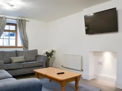 a living room with a couch and a coffee table at Sunset View-E4107A in Aspatria