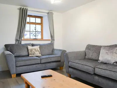 a living room with two couches and a coffee table at Sunset View-E4107A in Aspatria