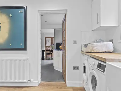 a kitchen with a washer and dryer at Finest Retreats - Willow Dene in Cockermouth