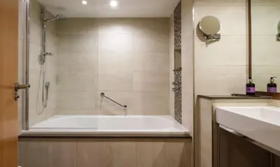 a bathroom with a tub and a sink at Blencathra in Keswick