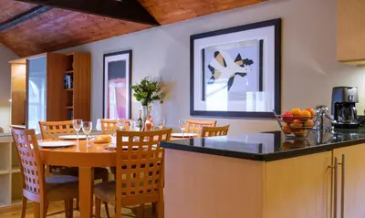 a kitchen and dining room with a table and chairs at Underscar - Stonethwaite in Keswick