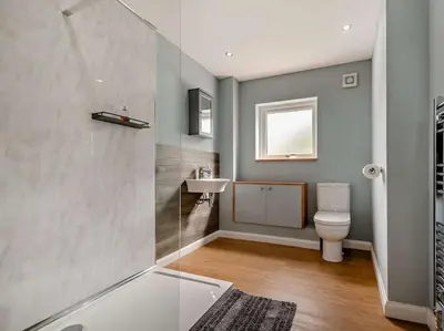 a bathroom with a toilet and a sink at 2 Bed seafront cottage in Portpatrick in Portpatrick