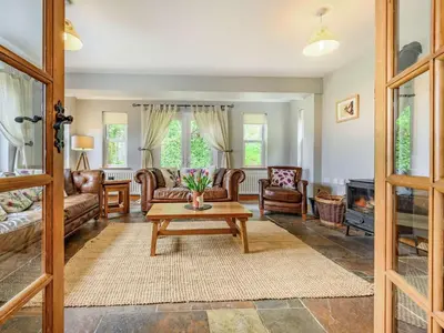a living room with couches and a coffee table at 3 Bed in Keswick oc-sz080 in Braithwaite