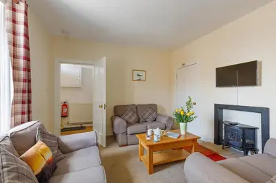a living room with two couches and a fireplace at 3 Bed in Drummore oc-k30214 in Drummore