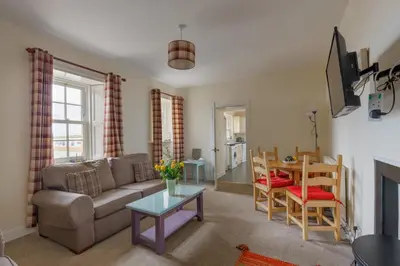 a living room with a couch and a table at 3 Bed in Drummore oc-p30213 in Drummore
