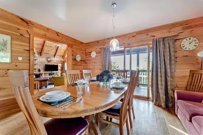 a dining room with a large wooden table and chairs at 3 Bed in Kippford oc-g30100 in Kippford