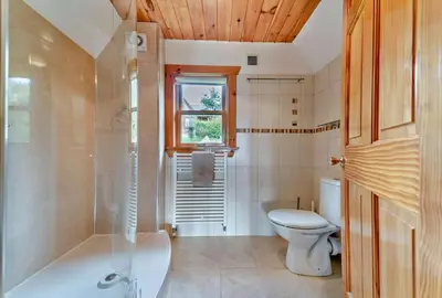 a bathroom with a toilet and a tub and a sink at 3 Bed in Kippford oc-g30100 in Kippford