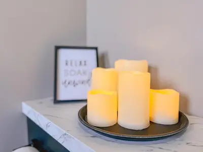 a group of yellow candles sitting on a table at Dogwood Lodge in Bassenthwaite