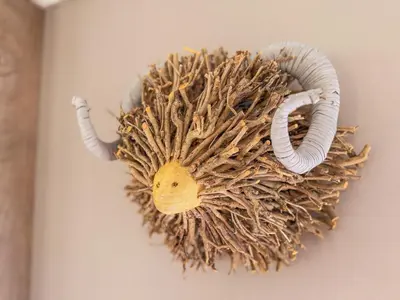 a decoration of an animal with horns on a wall at Dogwood Lodge in Bassenthwaite