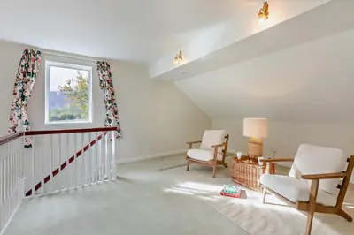 a living room with a staircase and a window at 3 Bed in Loweswater oc-w30224 in Loweswater