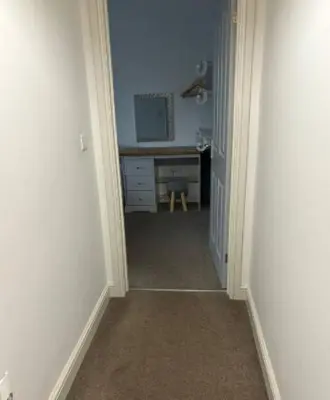 a hallway with a room with a desk and a hallwayngthngthngthngthngth at Unique, Large 2 bedroom Flat in Carlisle