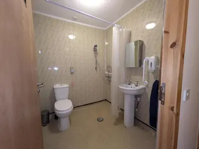 a bathroom with a toilet and a sink at Fantastic prices for stays of 4 weeks or more - ensuite double rooms -self-catering in Dumfries