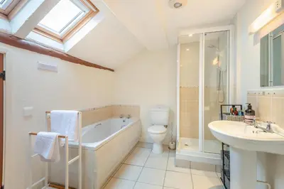 a bathroom with a tub and a toilet and a sink at 2 Bed in Greystoke oc-s30412 in Greystoke