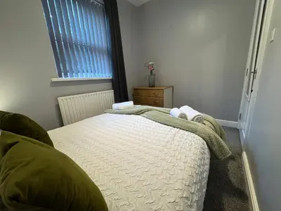 a bedroom with a bed and a window at Omega Apartment - 3 Bedrooms - Sleeps 5 in Whitehaven