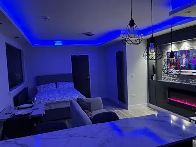 a bedroom with a bed and a blue ceiling at Modern Junior Suite, Seascale, Cumbria in Seascale