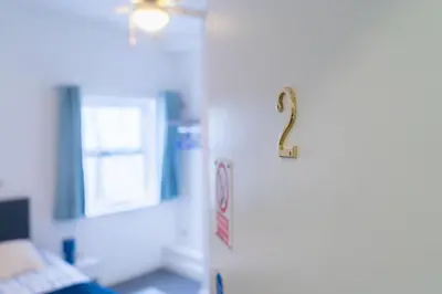 a door with a question mark on it in a room at Carlisle Comfort Terrace in Carlisle