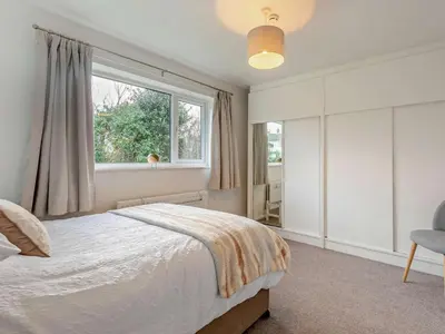 a bedroom with a large bed and a window at 3 Bed in Keswick 95858 in Keswick