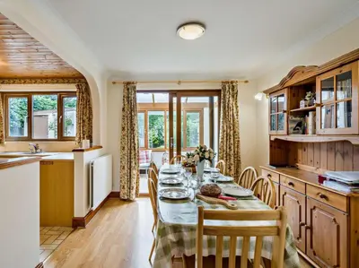 a kitchen and dining room with a table and chairs at 3 Bed in Wigton oc-95374 in Uldale