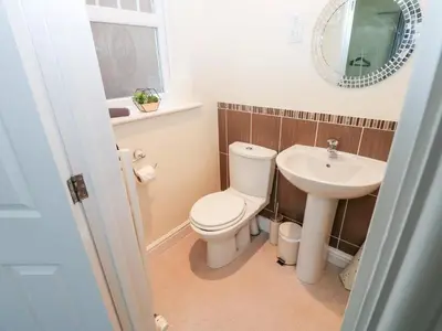 a bathroom with a toilet and a sink at Linga House - 3 Bedrooms - Sleeps 5 in Frizington