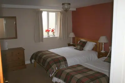 a hotel room with two beds and a window at StoneyAcre in Keswick