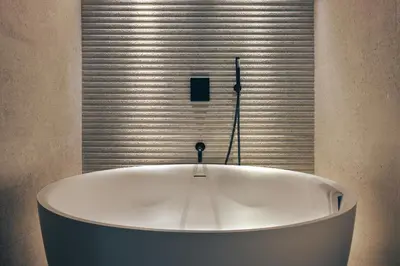 a white bath tub in a room with a window at The Retreat - Ridgestone in Penruddock