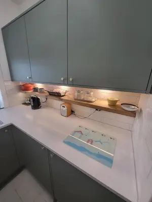 a kitchen with a counter top with a sink at The Wee House -Coorie Doon Stays in Troon