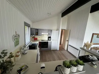 a kitchen with white appliances and a counter top at Fig Tree Lodge in Ellonby