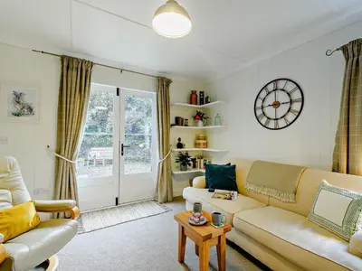 a living room with a couch and a table at 1 Bed in Maybole 93562 in Maybole