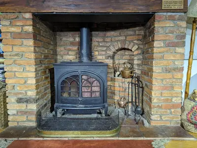 an old brick fireplace in a brick wall at The Hidden Mill, Historic Beauty Spot and spa in Castle Douglas