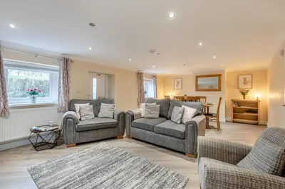 a living room with two couches and a table at 3 Bed in Isel oc-i30816 in Sunderland
