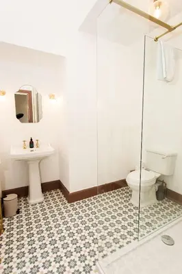 a bathroom with a toilet and a sink at Bedroom 2 - Rockcliffe in Dumfries