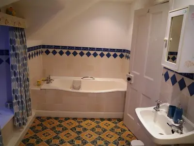 a bathroom with a tub and a sink at Colbeine in Rockcliffe