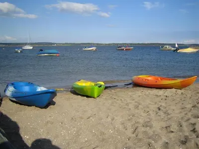 a group of three boats on the beach at Konkers in Girthon