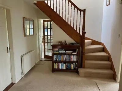 a staircase with a book shelf with books at Lonsdale in Rockcliffe