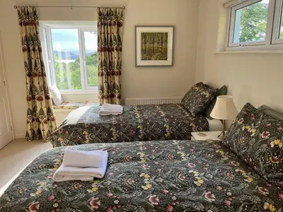 a bedroom with two beds and a window at Lonsdale in Rockcliffe